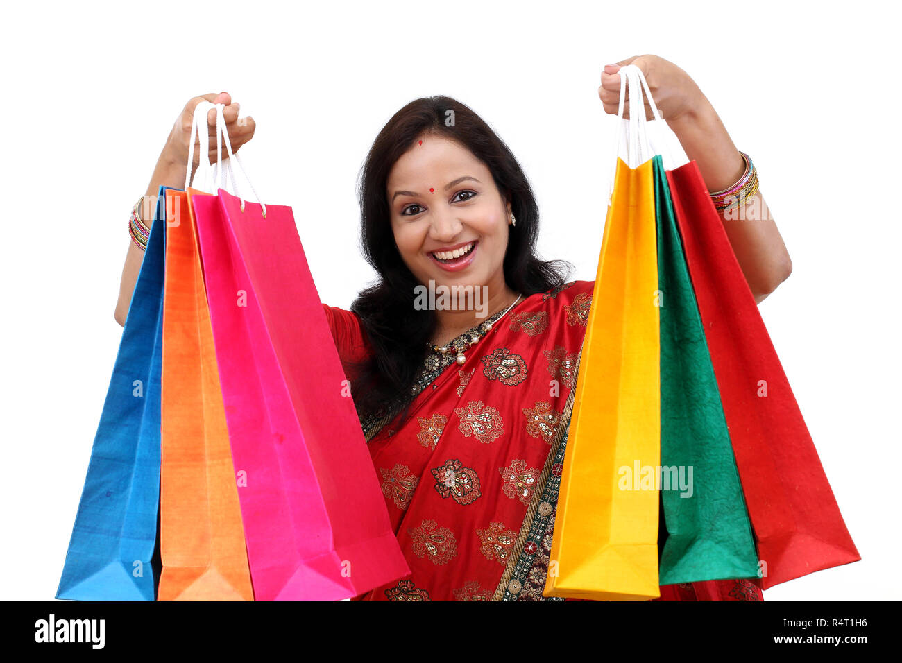 Traditional Indian woman holding shopping bags Stock Photo