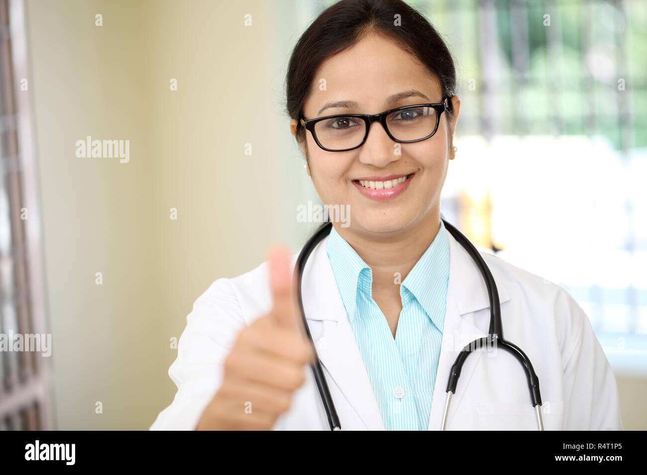 Indian doctor woman thumbs up hi-res stock photography and images - Alamy