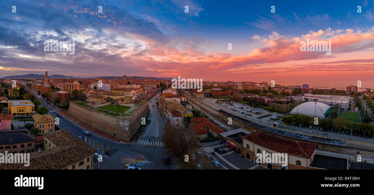 Aerial panorama of popular travel destination beach town Fano in Italy with sunset blue, red, purple sky near Rimini in the Marche region. Stock Photo