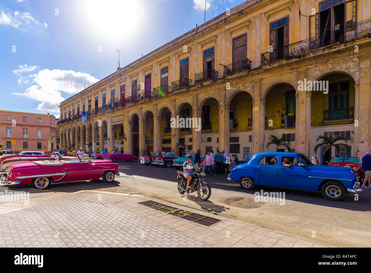 Classic colorful american car on the street of Havana. These cars are used as taxi for tourists and are typical of the Cuban capital. Stock Photo