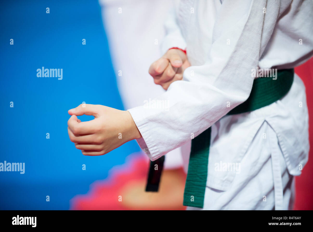 The karate kid with green belt Stock Photo