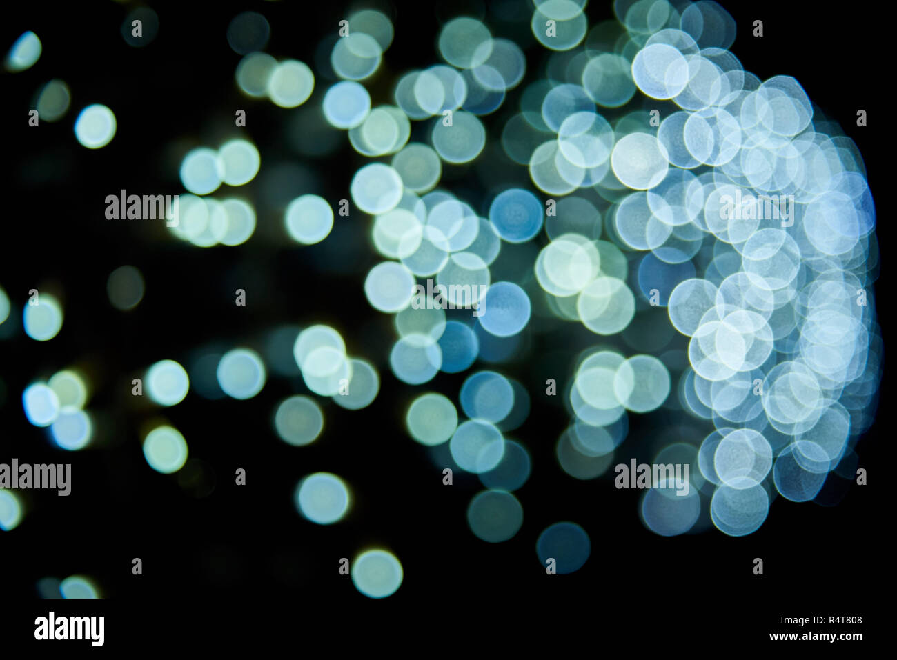 Abstract glitter bokeh on black background. Stock Photo