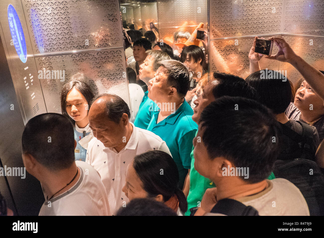 Tourist,tourists,in,lift,elevator,one,of,worlds fastest,on,way,down,from,observatory,tower,at,Taipei 101 Tower,Taipei,Chinese,China,Republic o China, Stock Photo