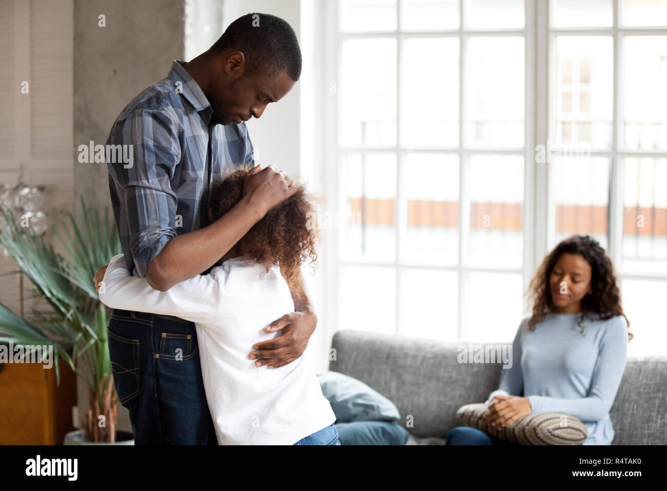 Unhappy African American family in living room divorce concept Stock Photo
