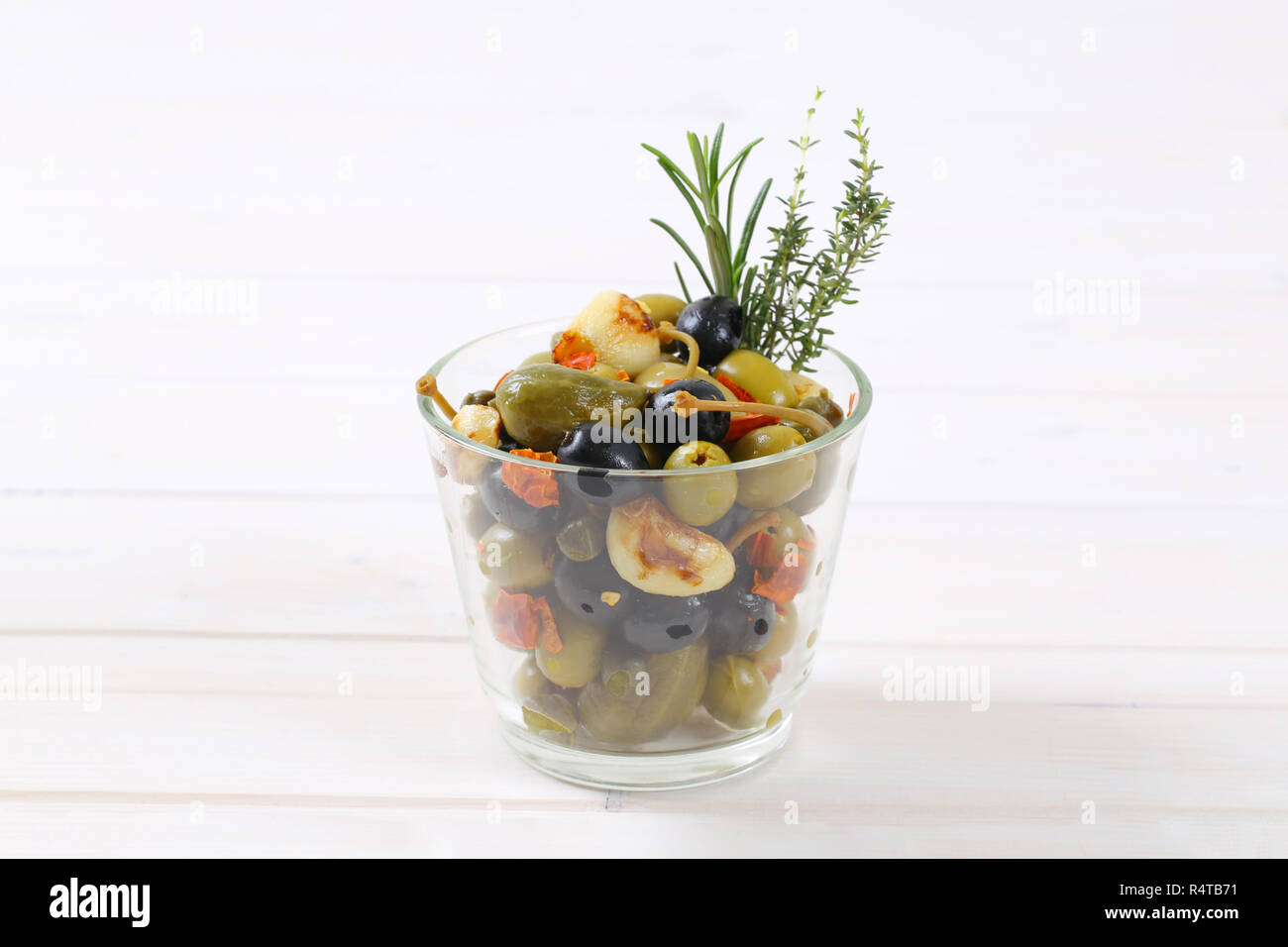 pickled olives, capers, caper berries and garlic Stock Photo Alamy