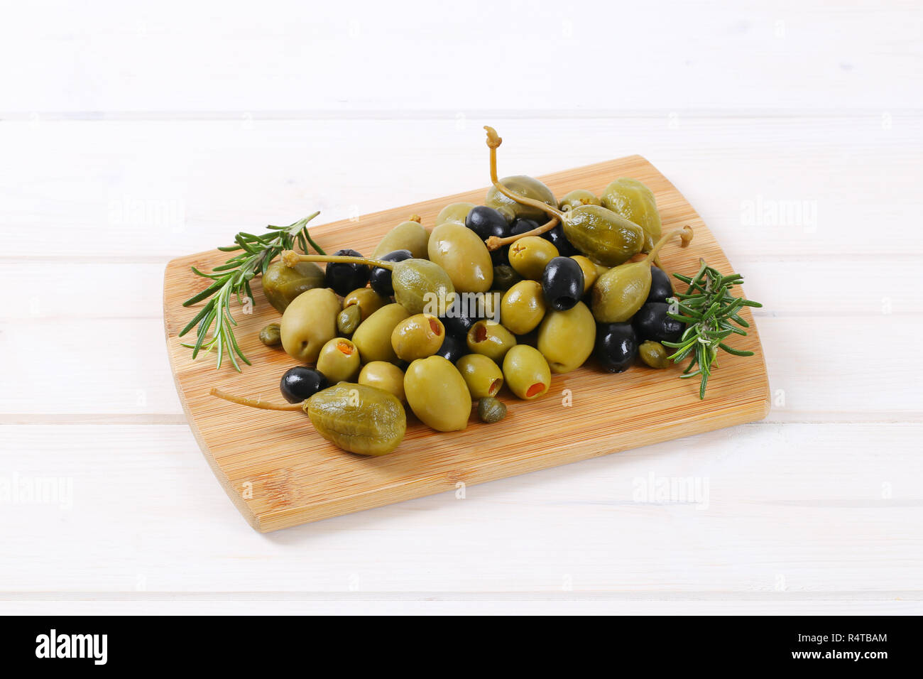 green and black olives with capers and caper berries Stock Photo Alamy