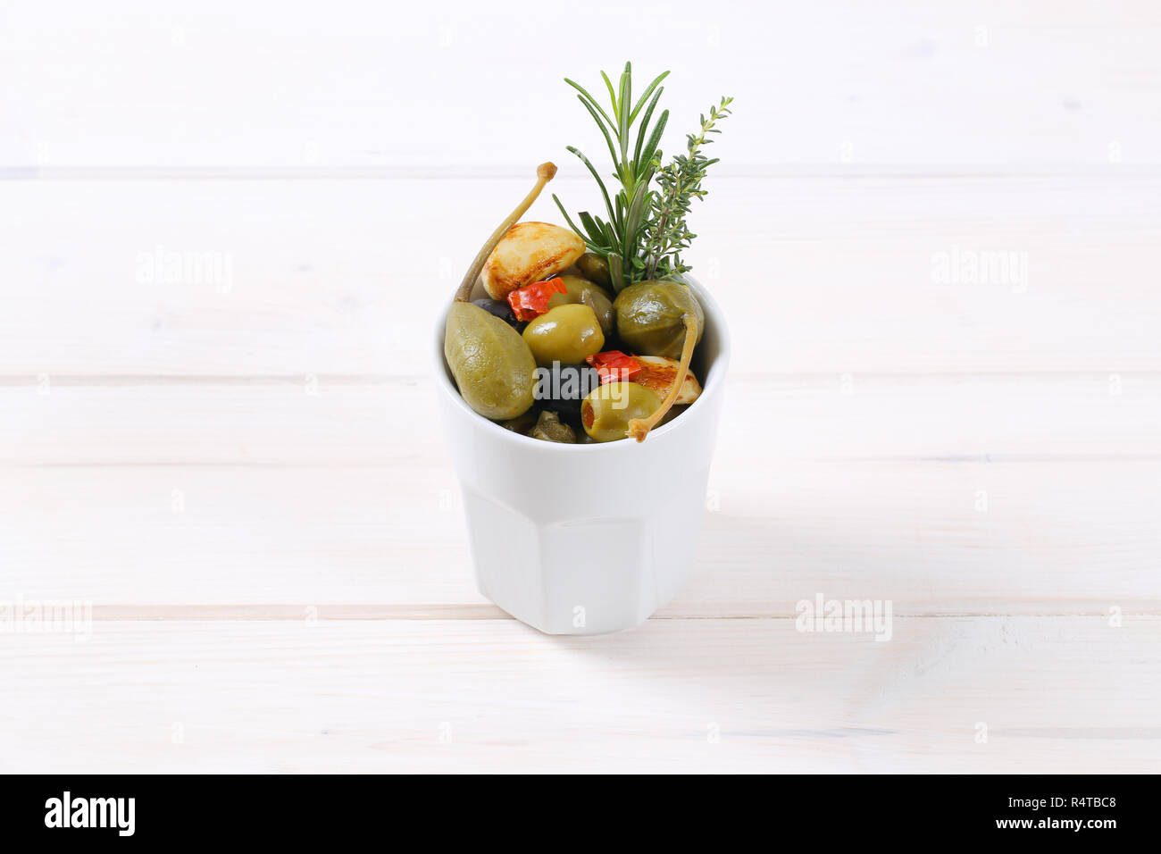 pickled olives, capers, caper berries and garlic Stock Photo Alamy