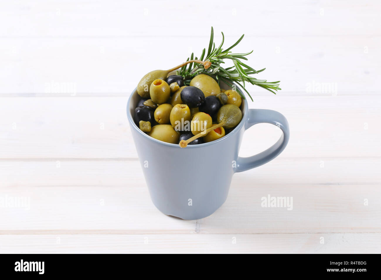 green and black olives with capers and caper berries Stock Photo Alamy