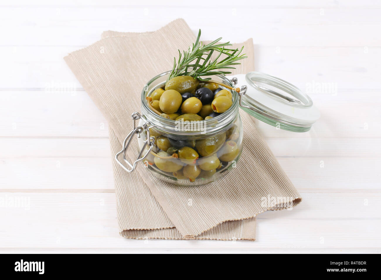green and black olives with capers and caper berries Stock Photo Alamy