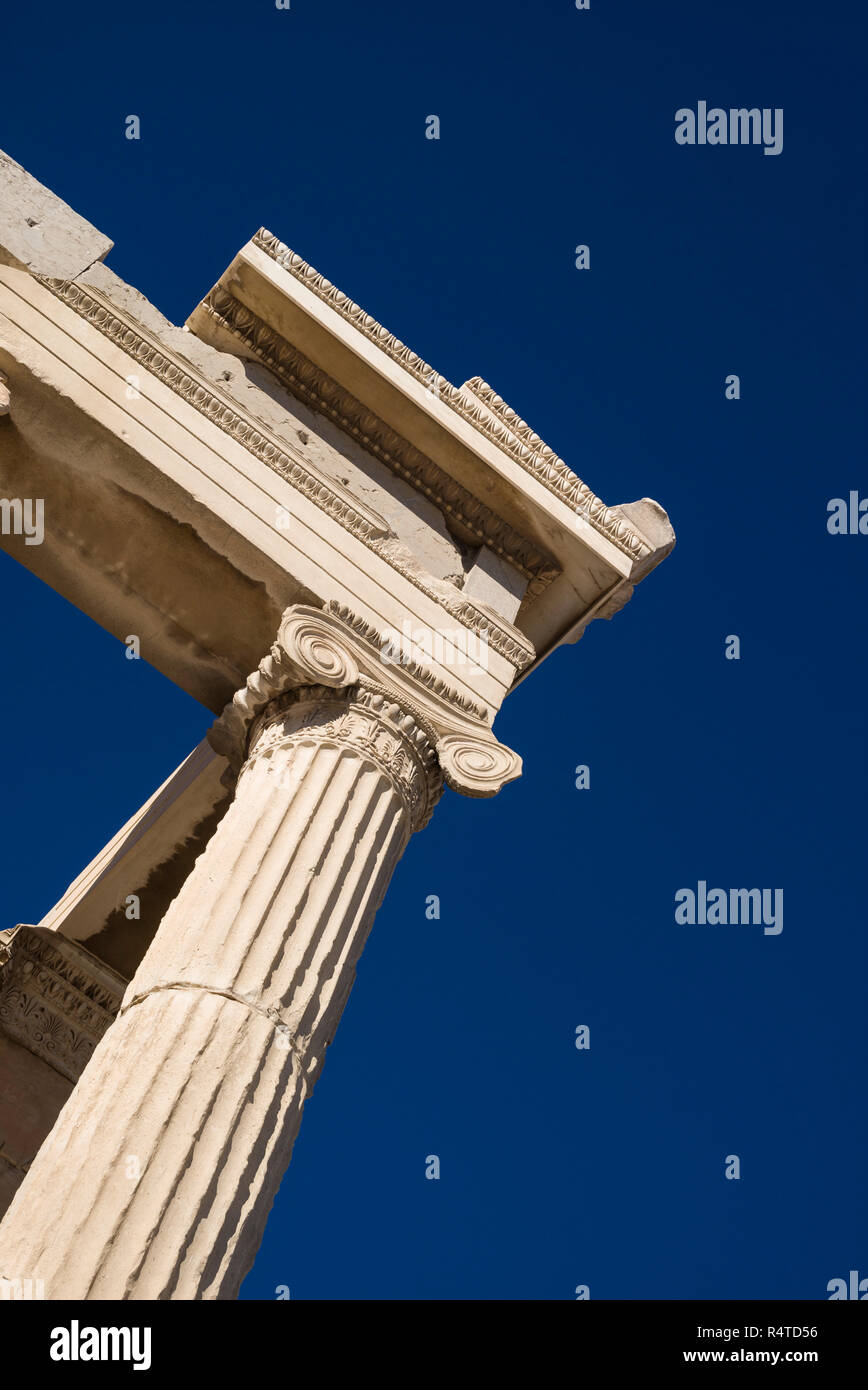 Athens. Greece. Detail of Ionic column (shaft) and capital of the Erechtheion (Erechtheum) ancient Greek temple on the Acropolis. Stock Photo