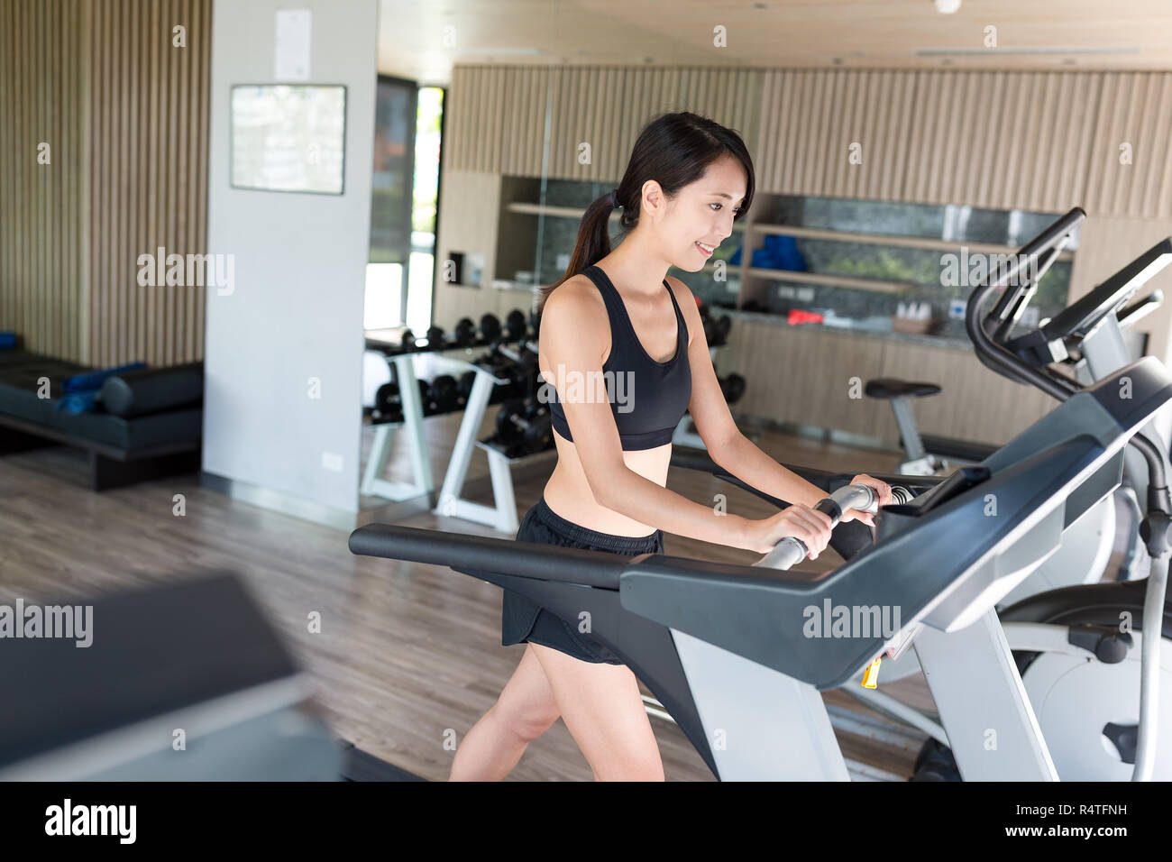 Sport Woman running on treadmill Stock Photo Alamy