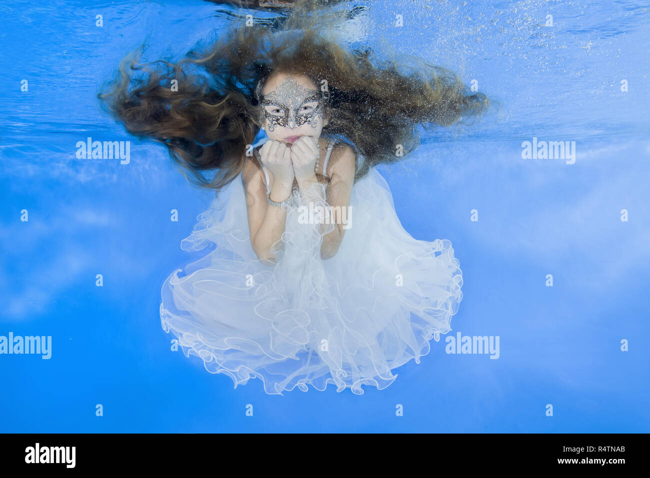 Girl in white dresses, posed underwater, Odessa, Ukraine Stock Photo