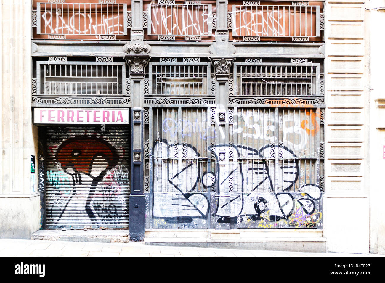 Graffiti on a closed Ferreteria or hardware store, Barcelona, Spain Stock  Photo - Alamy