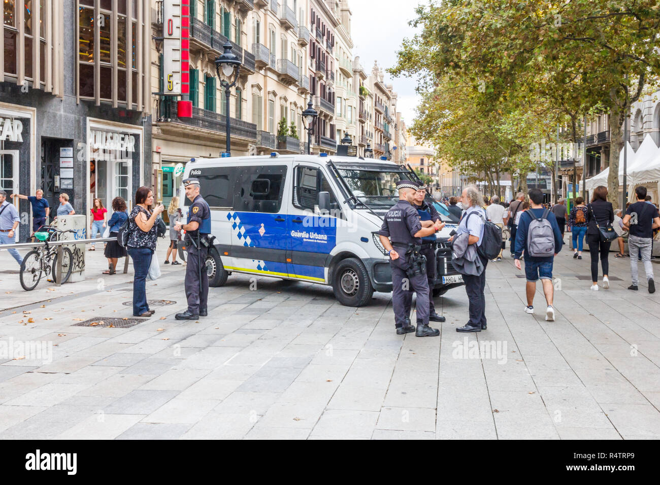 Barcelona, Spain - 4th October 2017: A police car guards a pedestrian street against terror attacks. Authorities in major cities are on high alert. Stock Photo