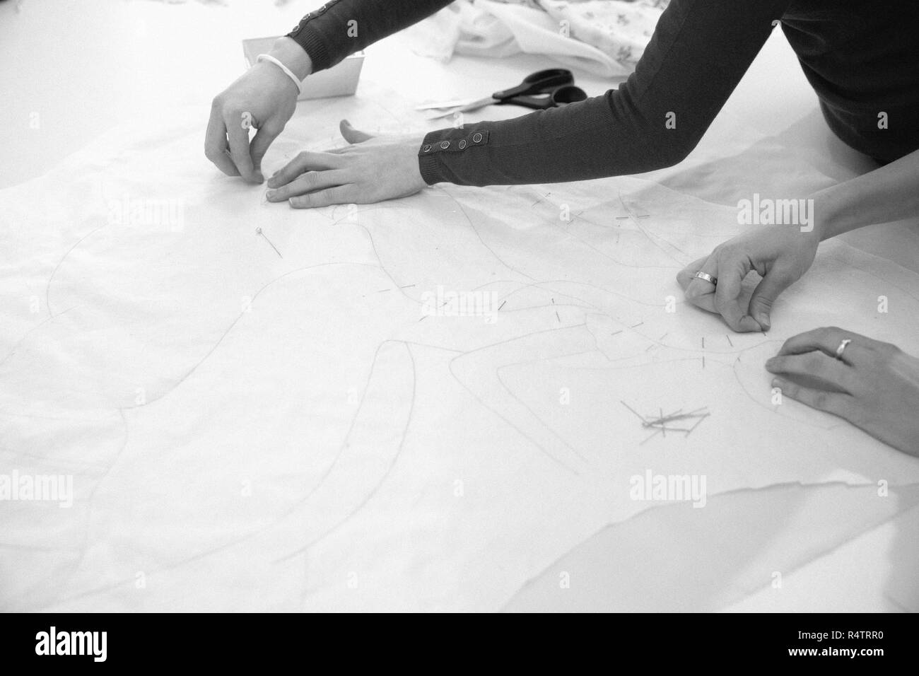 Hands woman sewing cloth Black and White Stock Photos & Images - Alamy