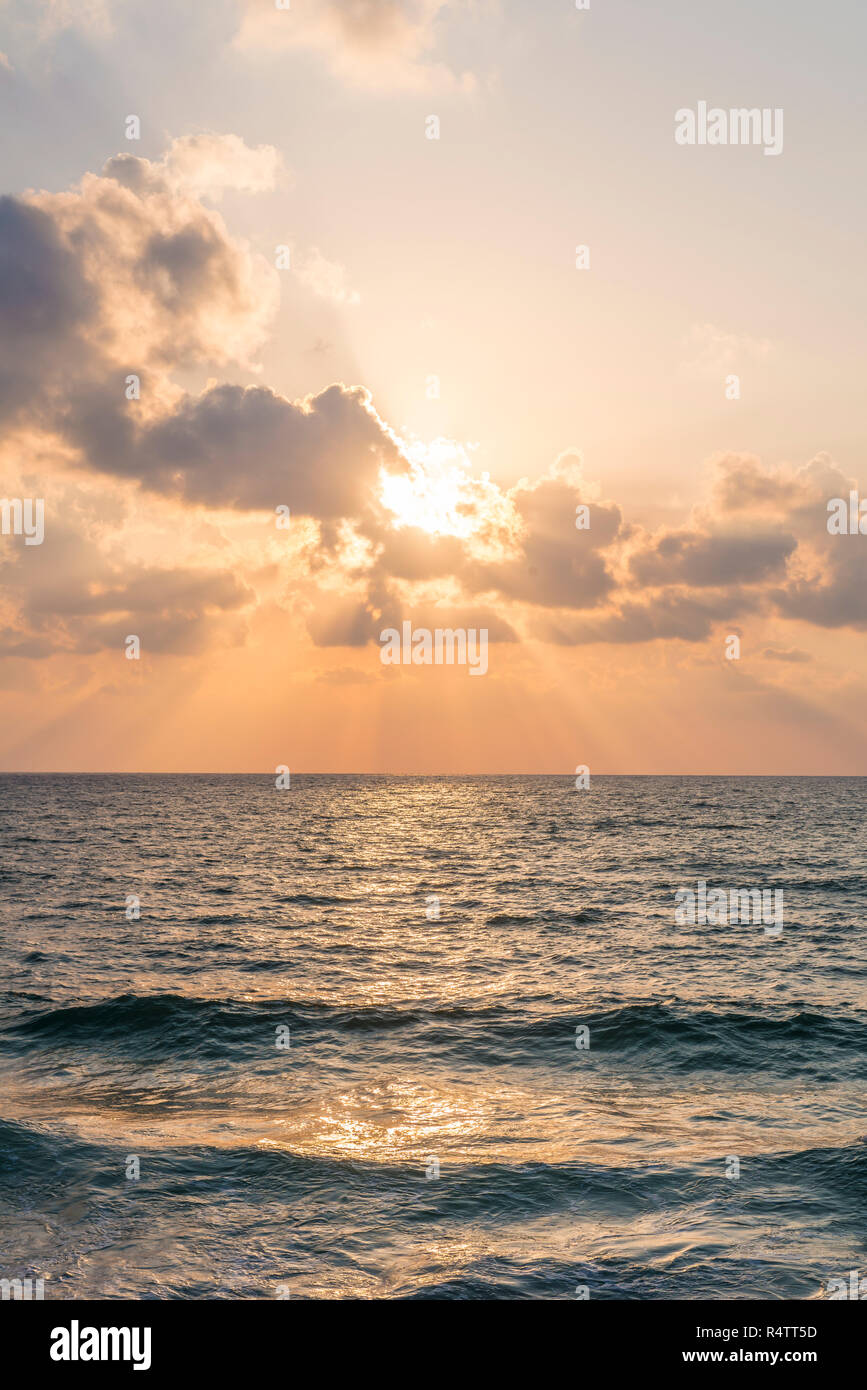 Sunset over the sea, clouds with sunrays, Tel Aviv, Israel Stock Photo