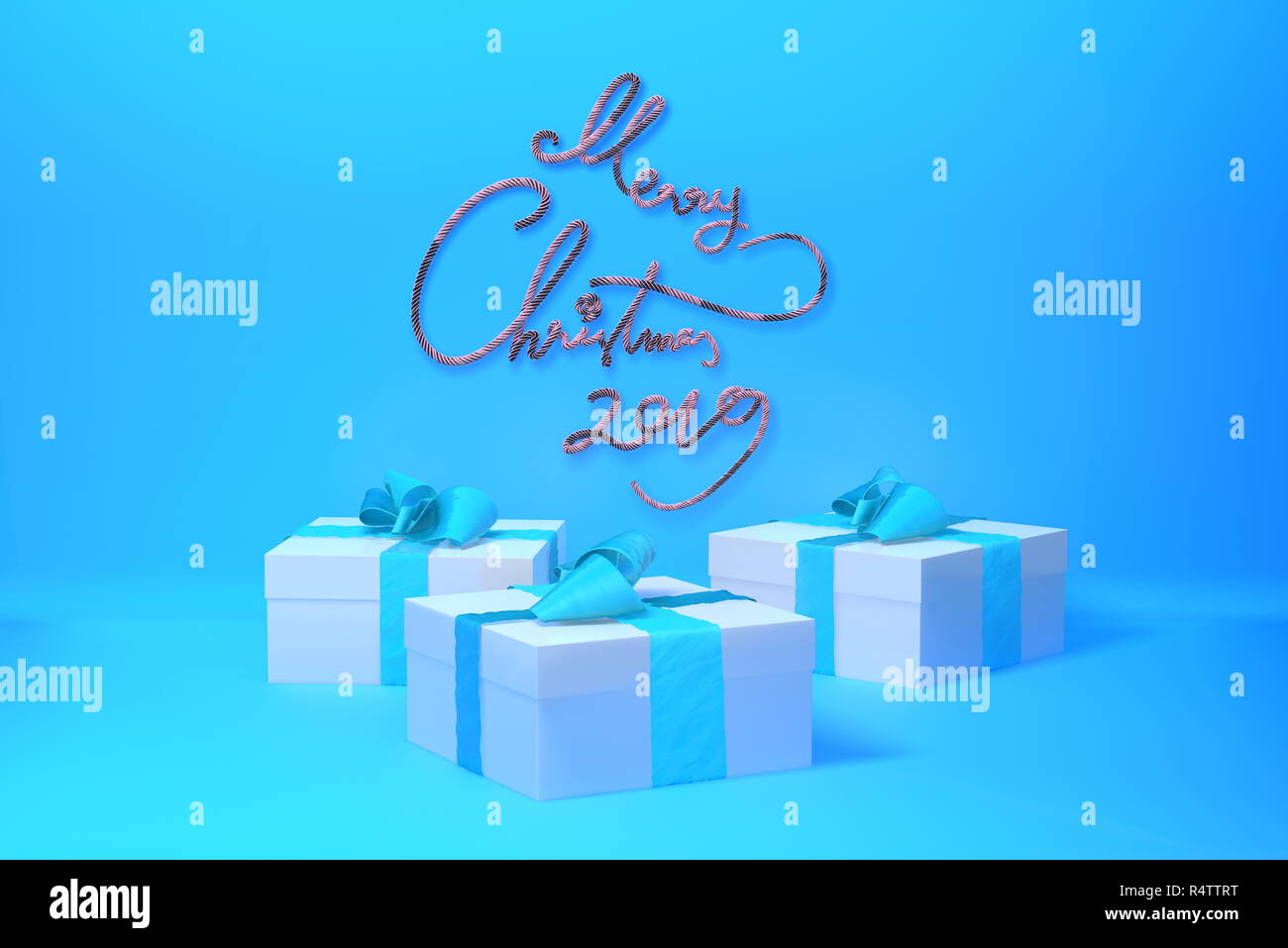 Merry Christmas 2019 lettering written in trendy blue color wall and three present gift boxes with bows beside. 3d illustration Stock Photo