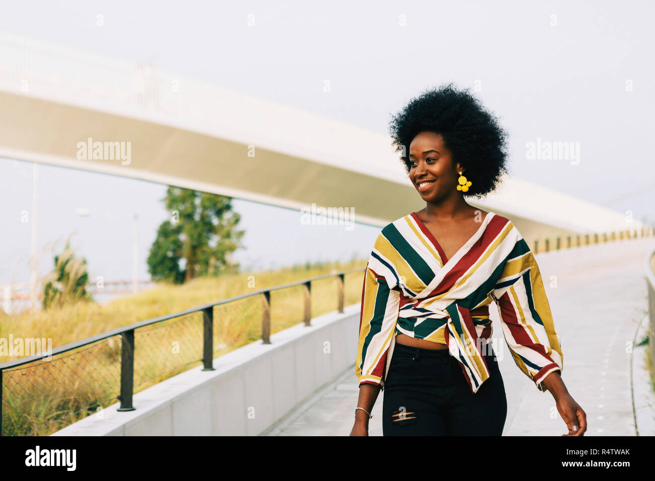 Black woman walking away on sidewalk hi-res stock photography and ...