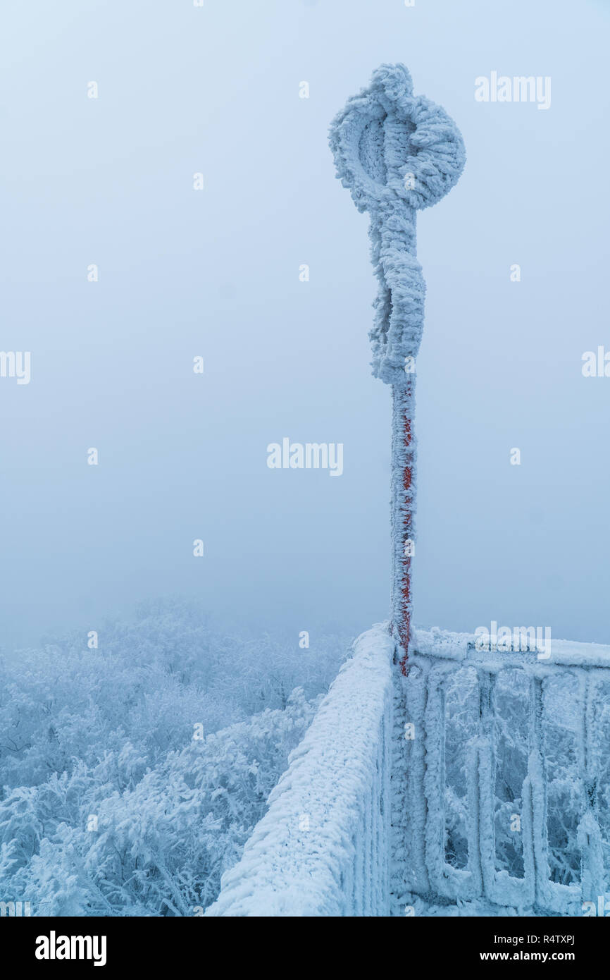 A frozen warning sign on top of the Buchkogelwarte in Burgenland, Austria Stock Photo
