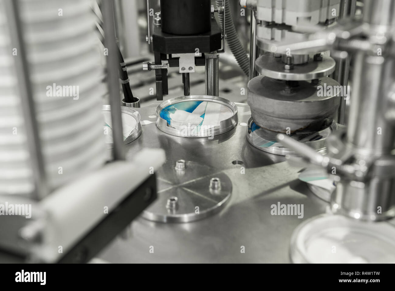 production and bottling of yogurt in plastic cups. equipment at the