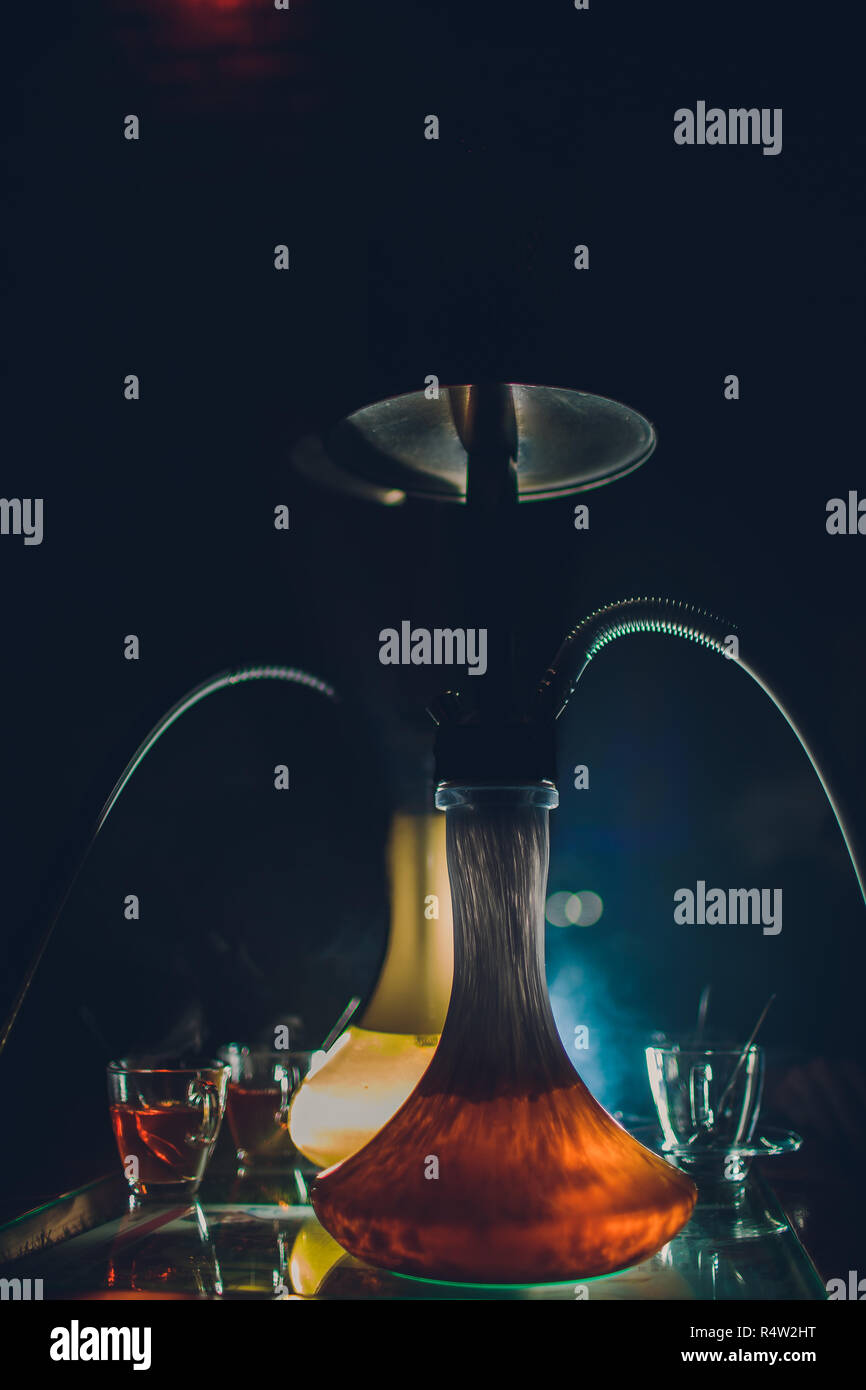 Hookah hot coals on shisha bowl with black background. Stylish oriental shisha. Shisha Concept