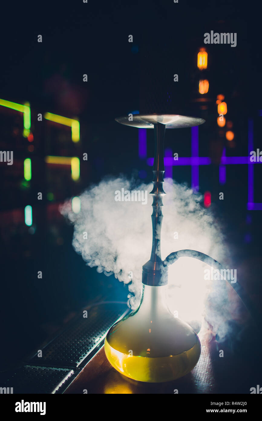 Hookah hot coals on shisha bowl with black background. Stylish oriental