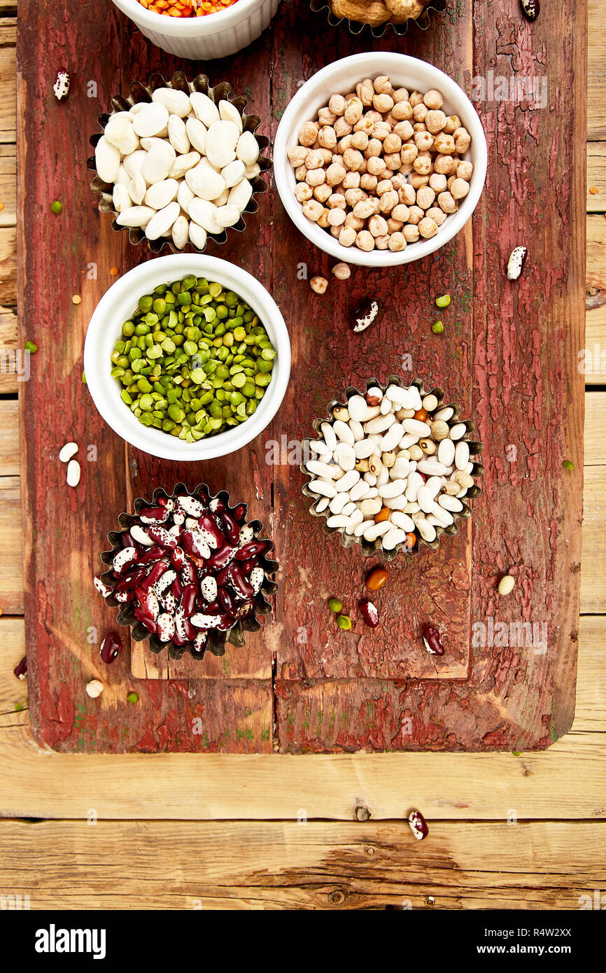 Bowls of various legumes red turkish lentils, chickpeas, beans, peanuts