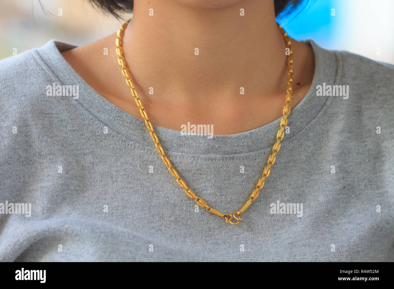 Golden neck chain hi-res stock photography and images - Alamy
