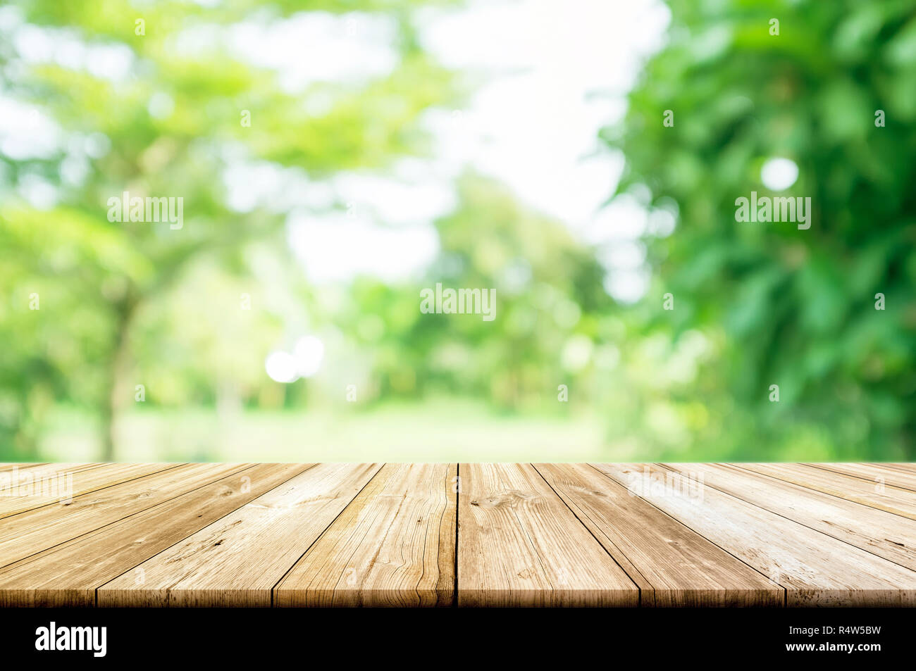 Empty wooden table top with blurred green garden background Stock Photo ...
