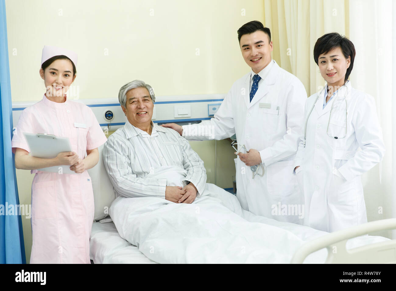 Medical workers and patients in the ward Stock Photo