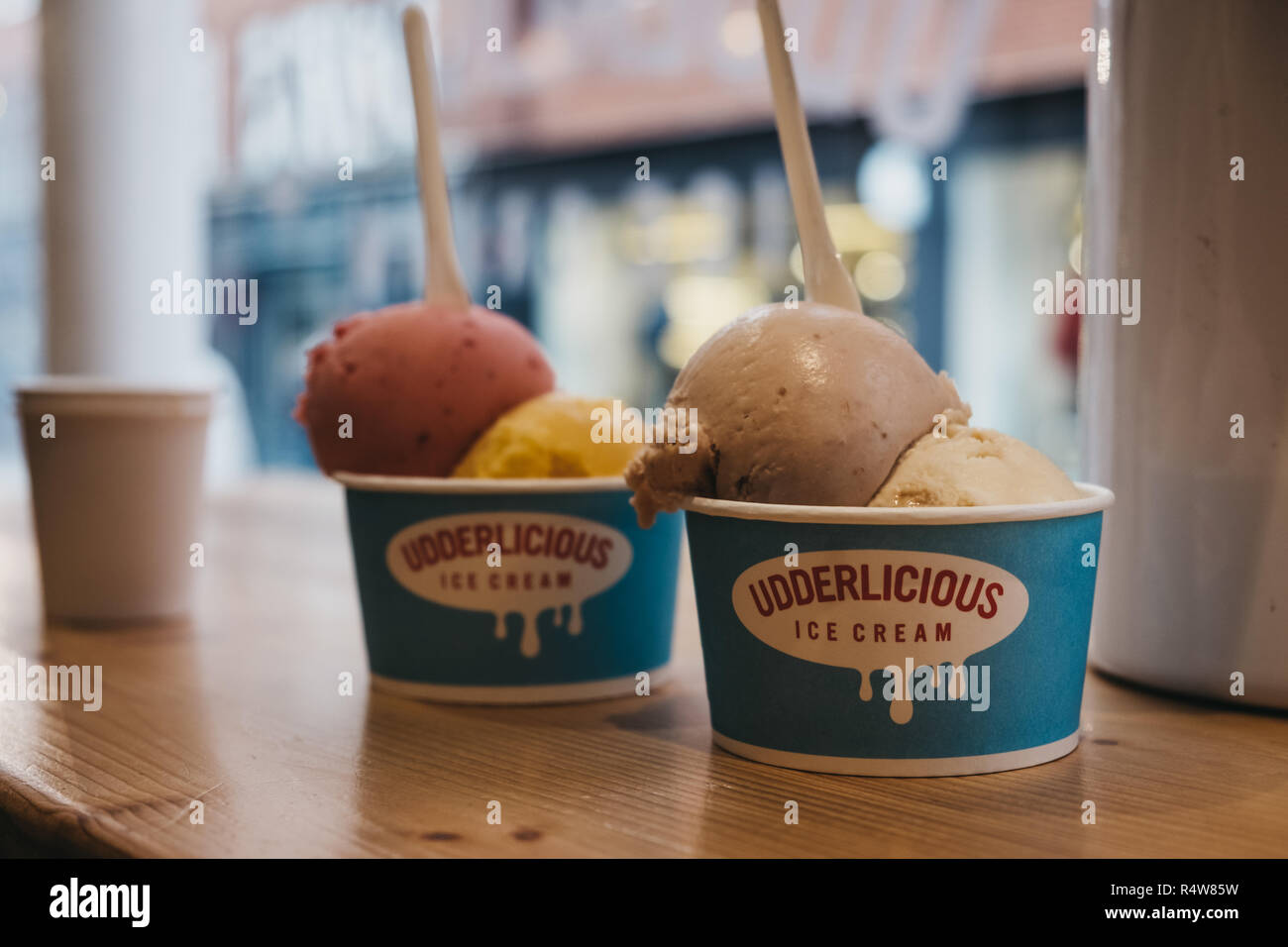 London, UK - November 21, 2018: Tubs of ice-cream on a table inside Udderlicious, an independent ice-cream parlour in Covent Garden, London, UK. Stock Photo