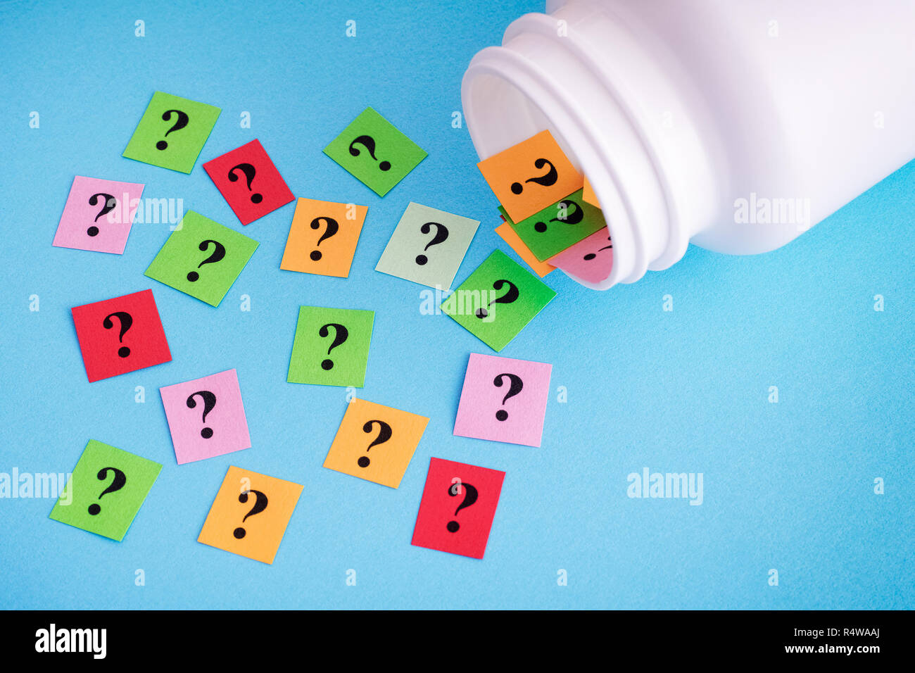 Question marks spilling out of medical bottle. Close up Stock Photo Alamy