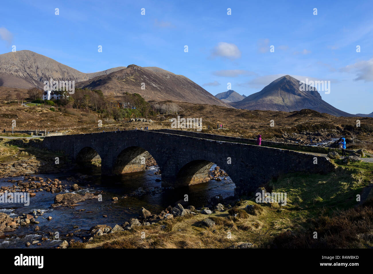 The old stone bridge over the Sligachan River with a backdrop of the Cuillin Hills, Isle of Skye, Highland Region, Scotland, UK Stock Photo