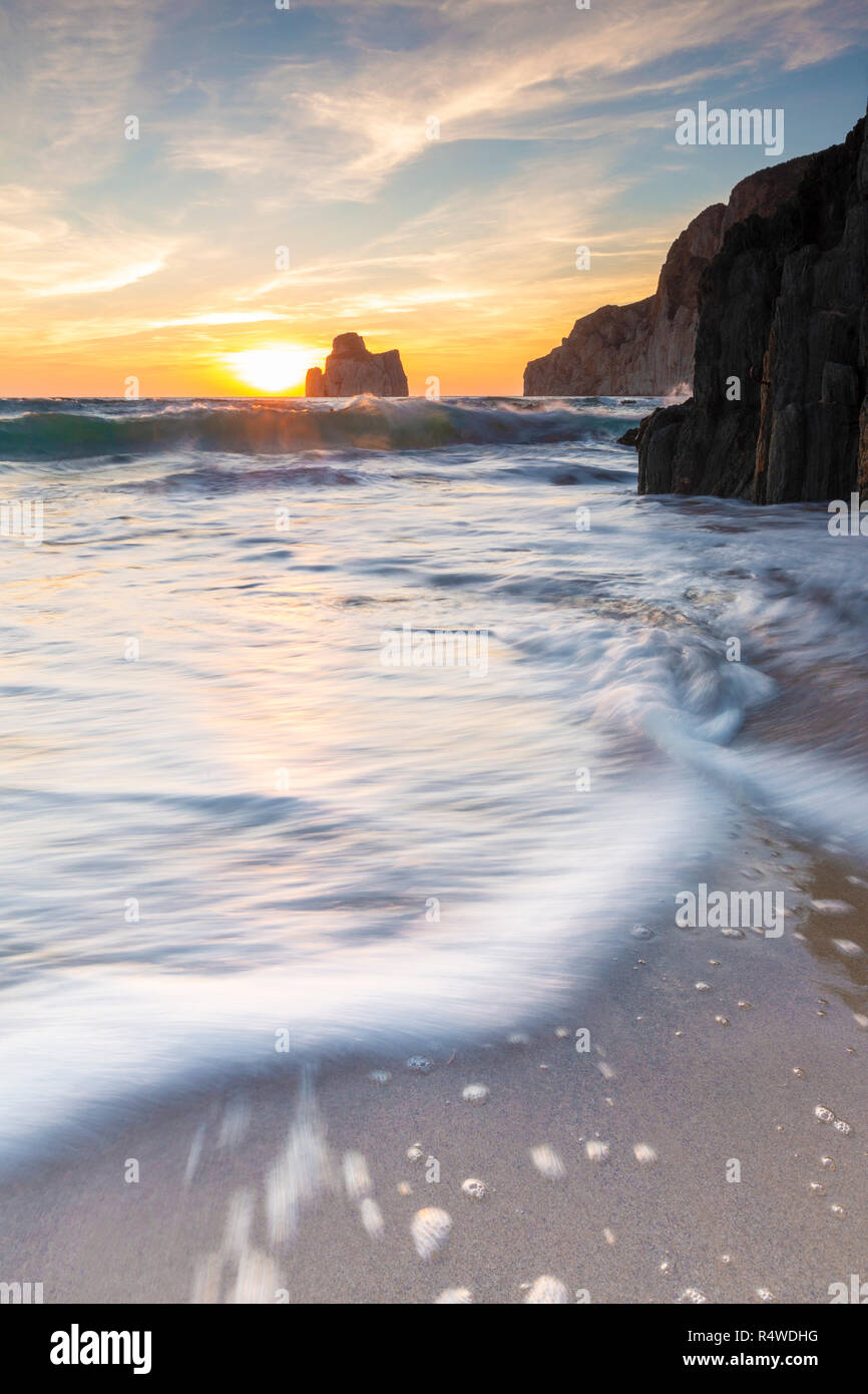 Waves at sunset on the Beach of Masua, Iglesias, Sud Sardegna province,  Sardinia, Italy, Europe Stock Photo - Alamy
