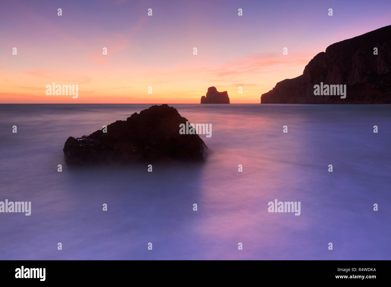 The sunset is reflected on the Beach of Masua, Iglesias