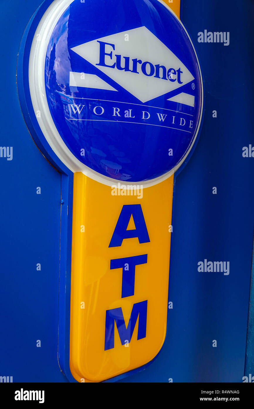Blue and yellow ATM machine, Euronet, Mryties, Kalymnos, Greece Stock Photo