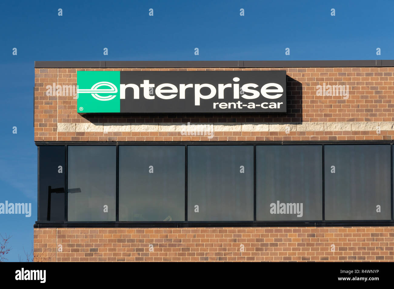 ST. PAUL, MN/USA - NOVEMBER 18, 2018: Enterprise car rental front and sign. Enterprise Rent-A-Car is a car rental company headquartered in the United  Stock Photo