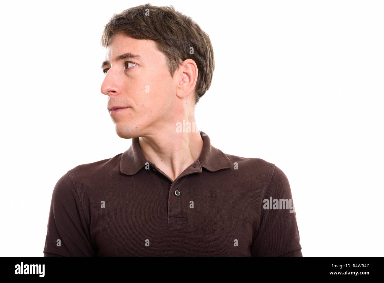 Studio shot of man looking away against white background Stock Photo