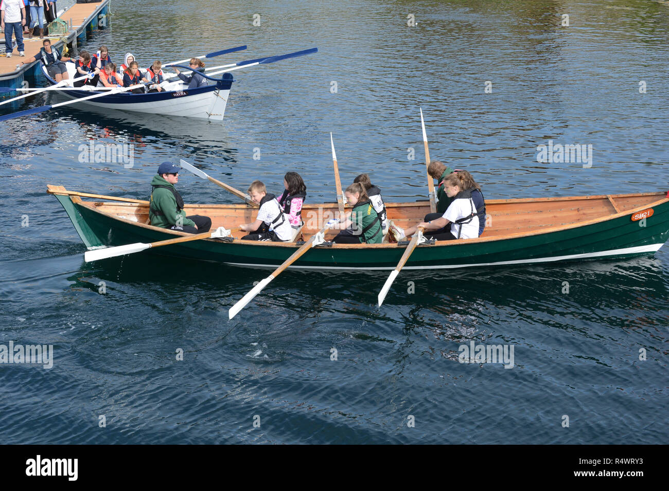 Shetland rowing regatta being held in Hamnavoe Burra in the Shetland Islands during the summer. Local teams race for each district Stock Photo