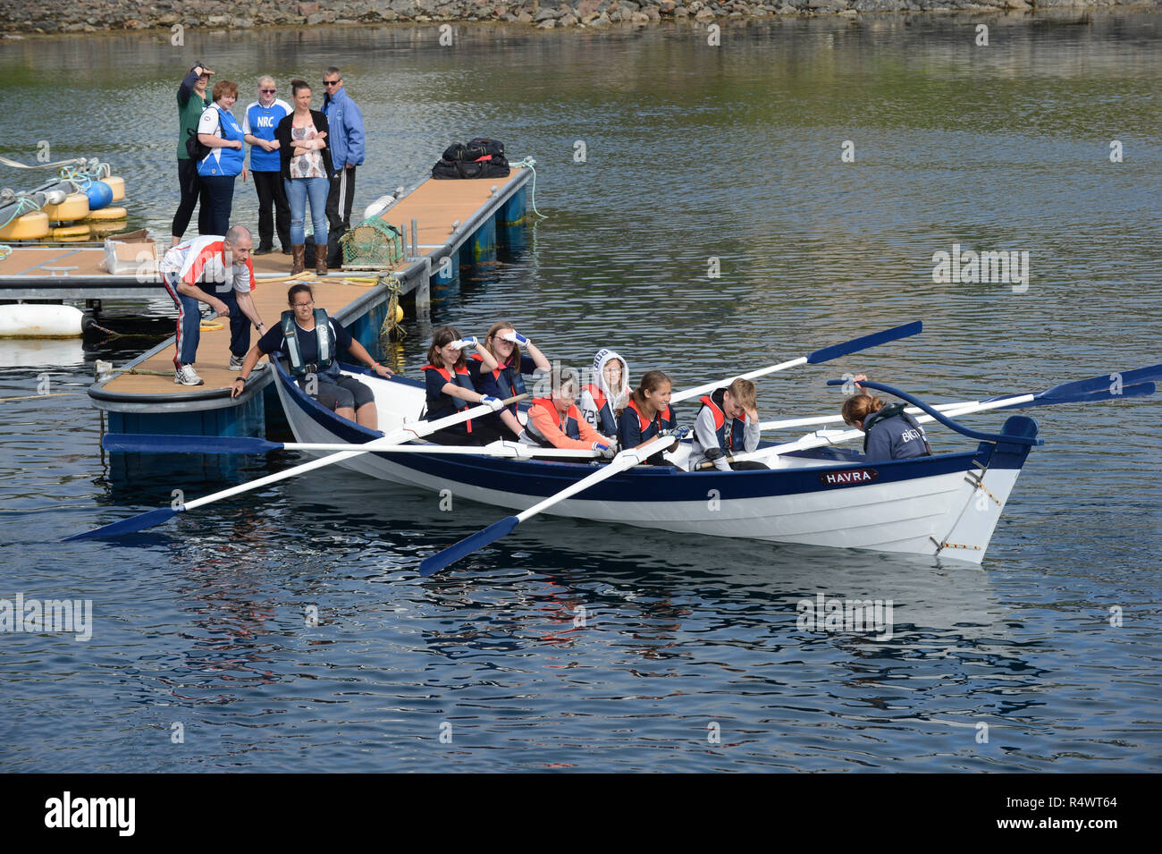 Shetland rowing regatta being held in Hamnavoe Burra in the Shetland Islands during the summer. Local teams race for each district Stock Photo