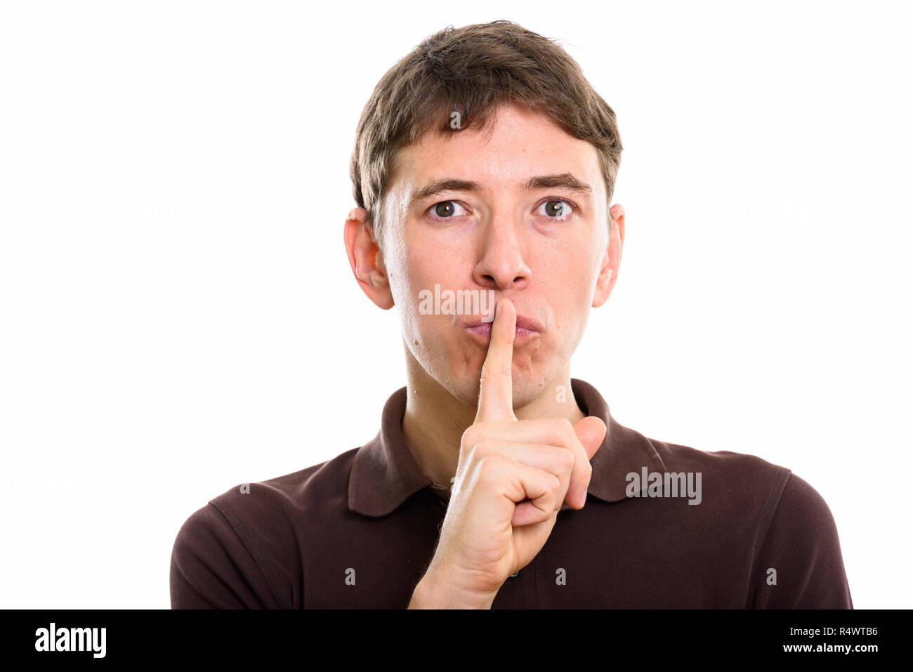 Close up of man with finger on lips Stock Photo