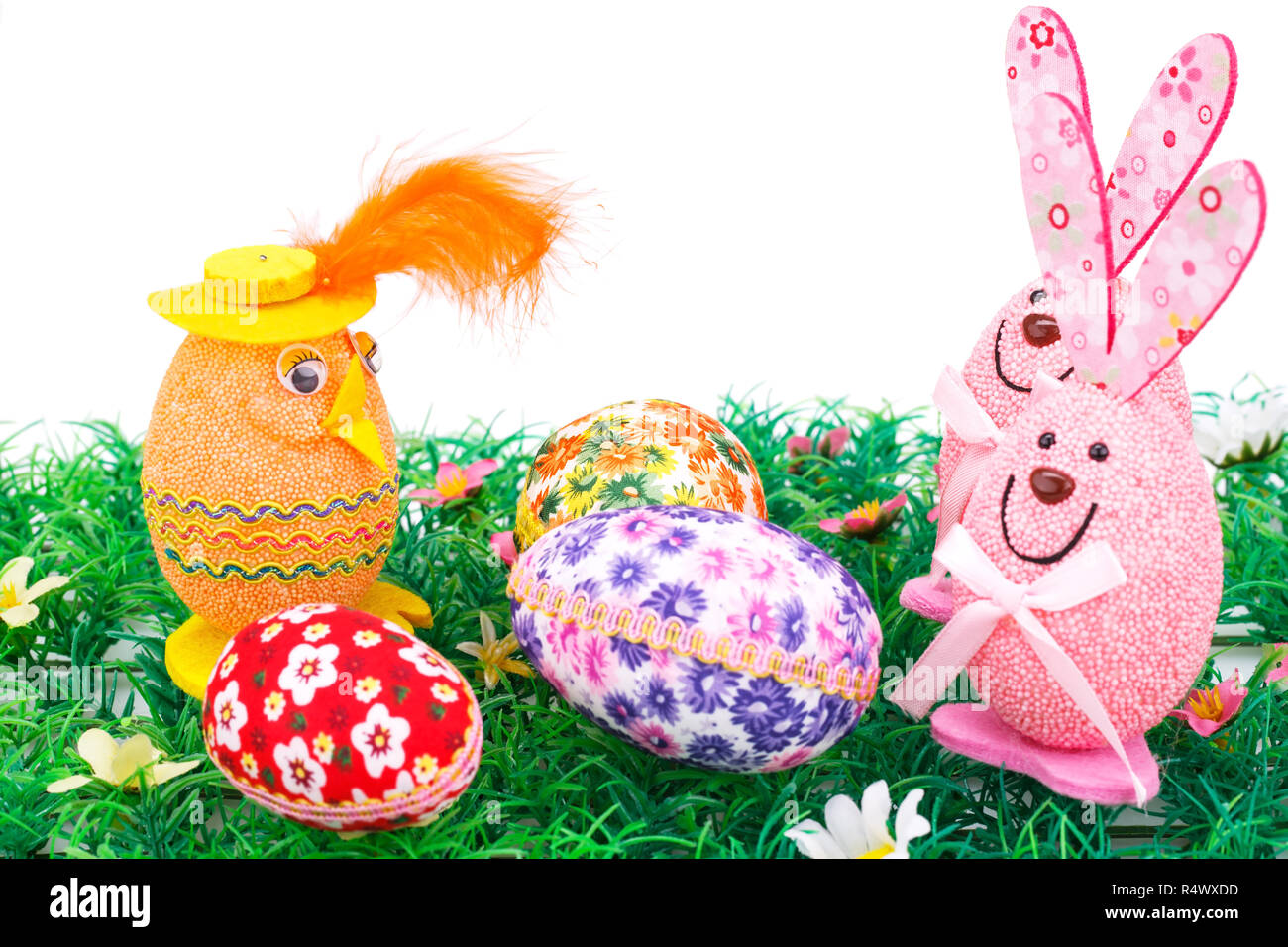 Easter eggs and bunnies decoration on artificial grass Stock Photo - Alamy