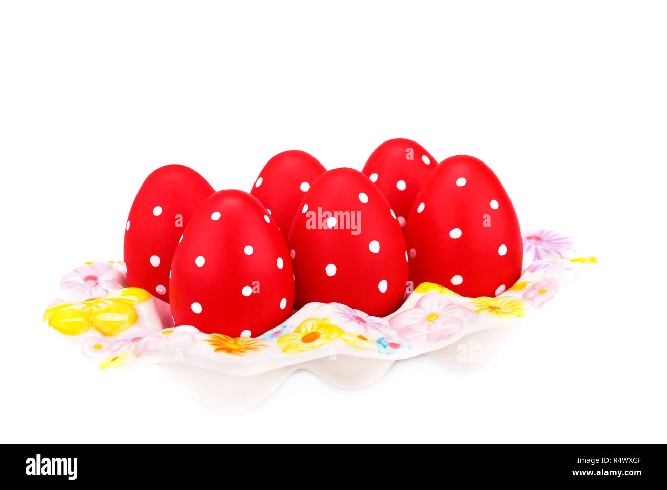 Easter eggs on ceramic setting isolated on white background. Stock Photo