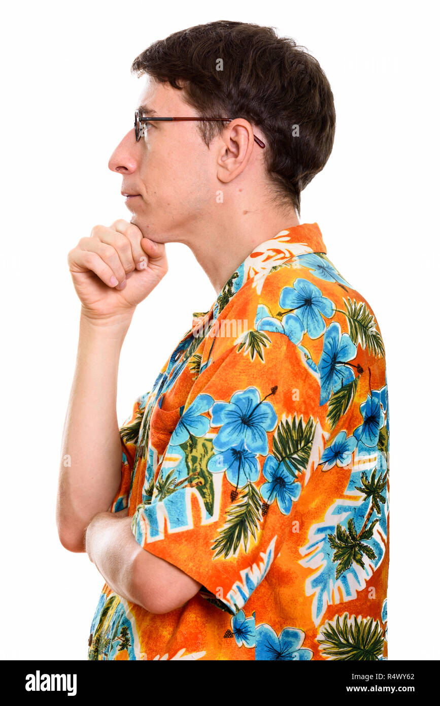 Profile view of tourist man thinking with hand on chin Stock Photo