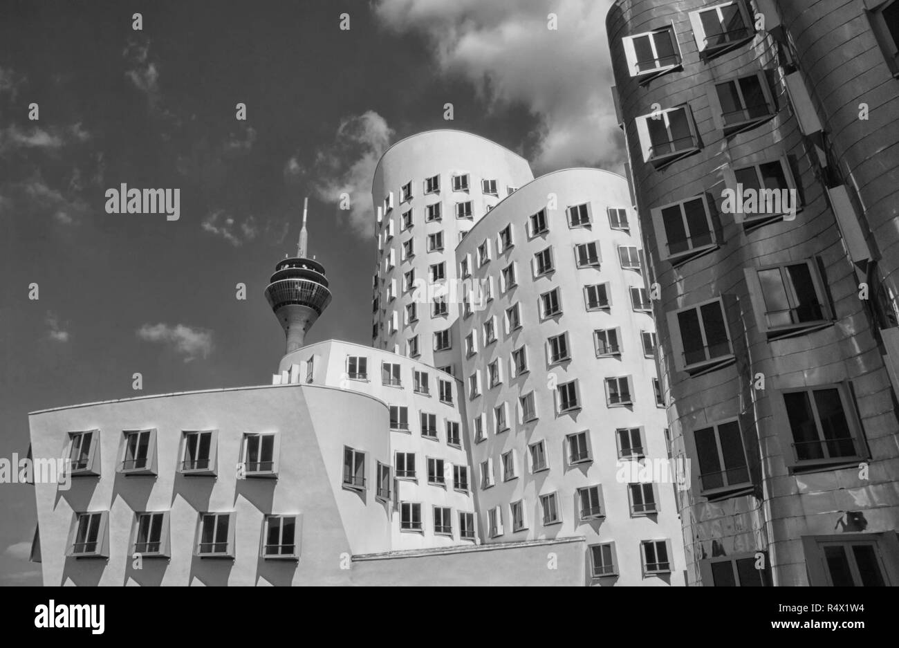 Dusseldorf, Germany - May 25, 2017: Gehry-Buildings (Gehry-Bauten) and Rhine Tower (Rheinturm) in Media harbor Stock Photo