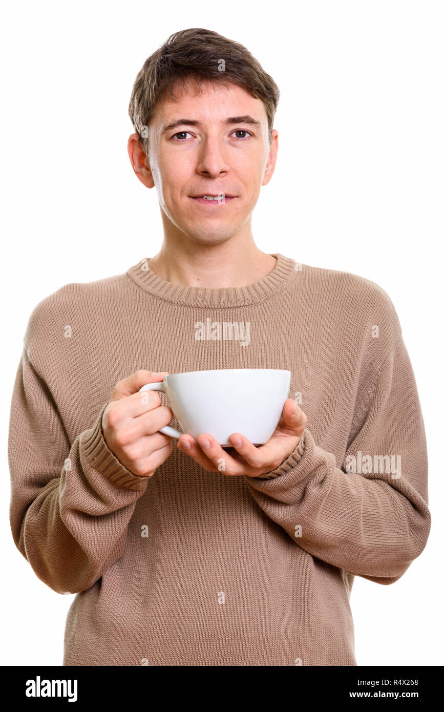 Studio shot of man holding coffee cup Stock Photo