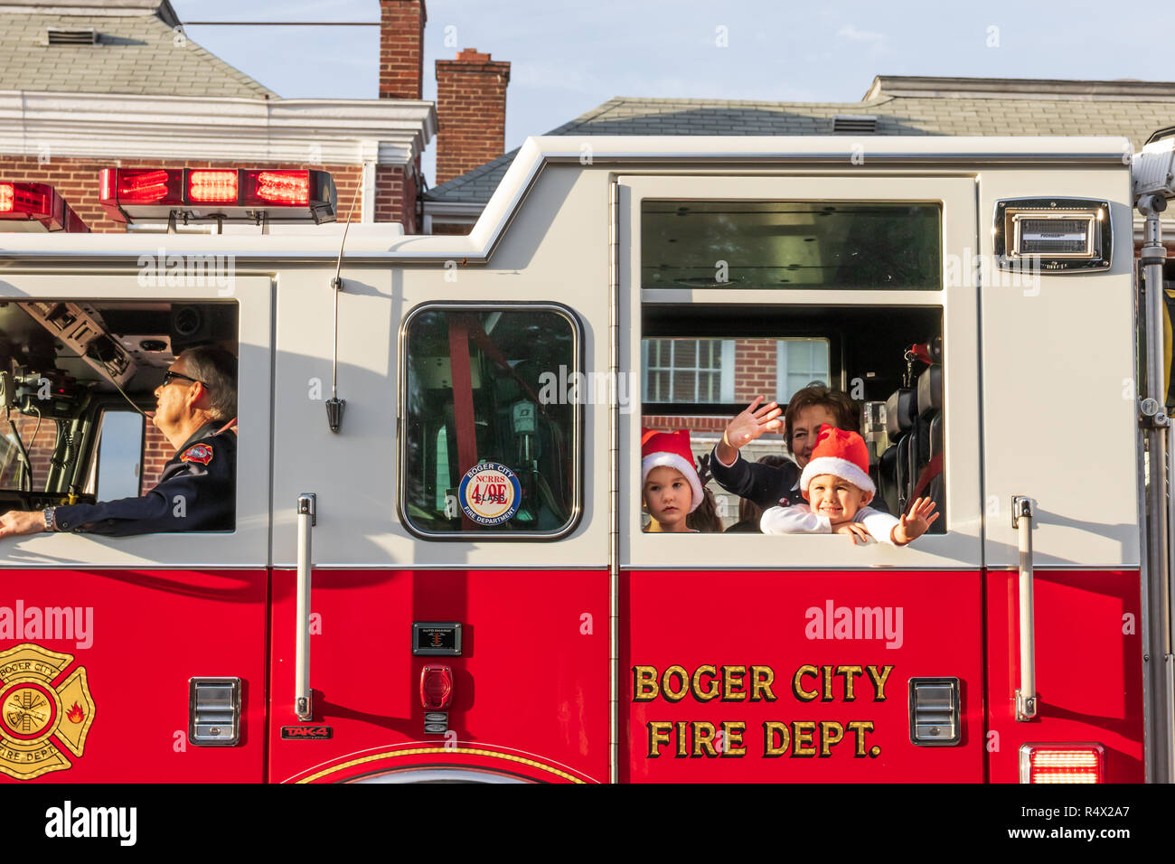 LINCOLNTON, NC, USA11/25/18 Two young children ride with their mother