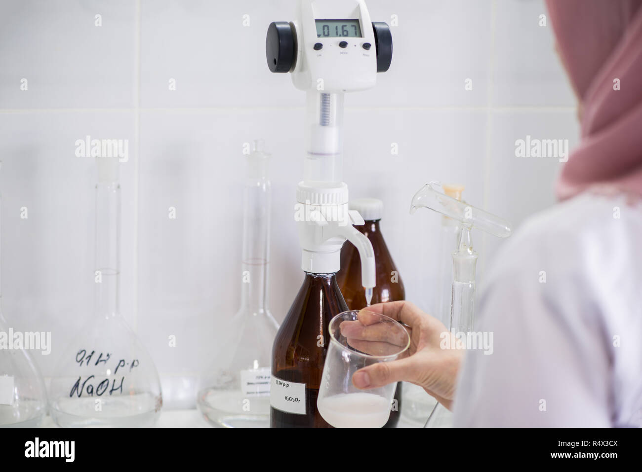 woman testing samples of dairy products in the laboratory. test