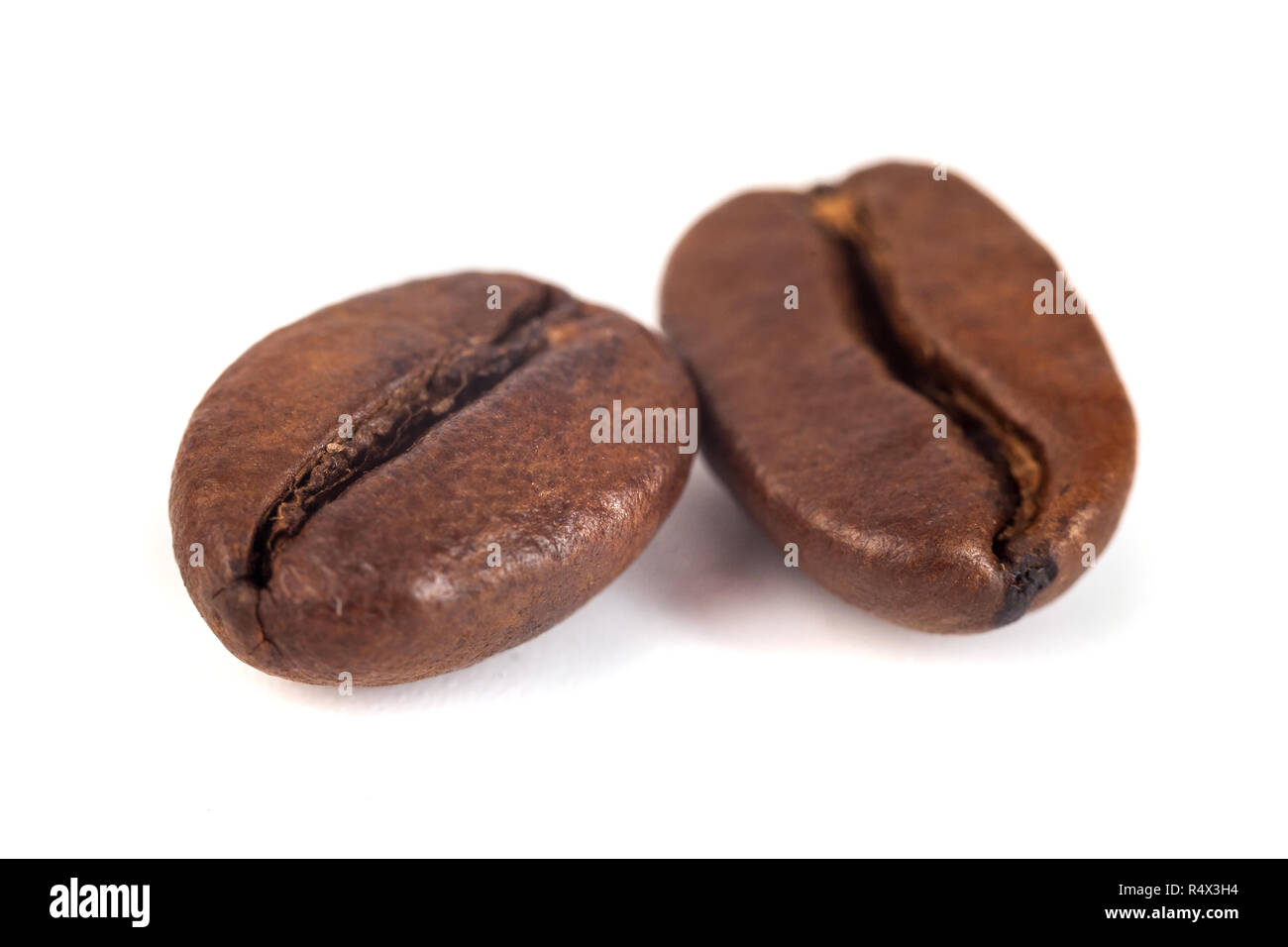 roasted coffee beans isolated on white background Stock Photo - Alamy