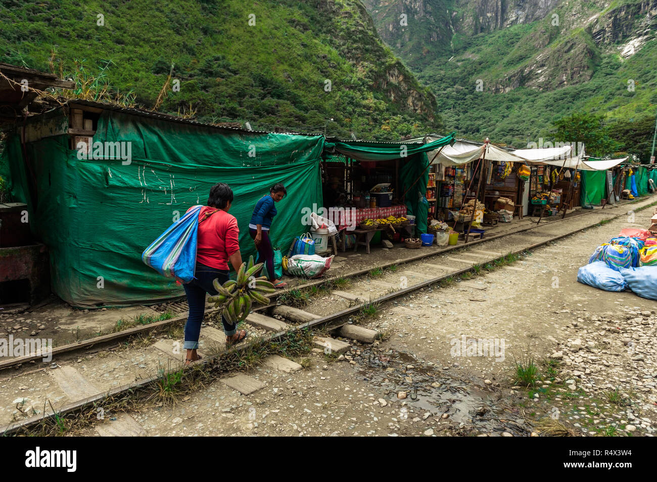 The railroad track crossing jungle and connecting Machu Picchu village to hydroelectric station, mostly used for tourism and car Stock Photo